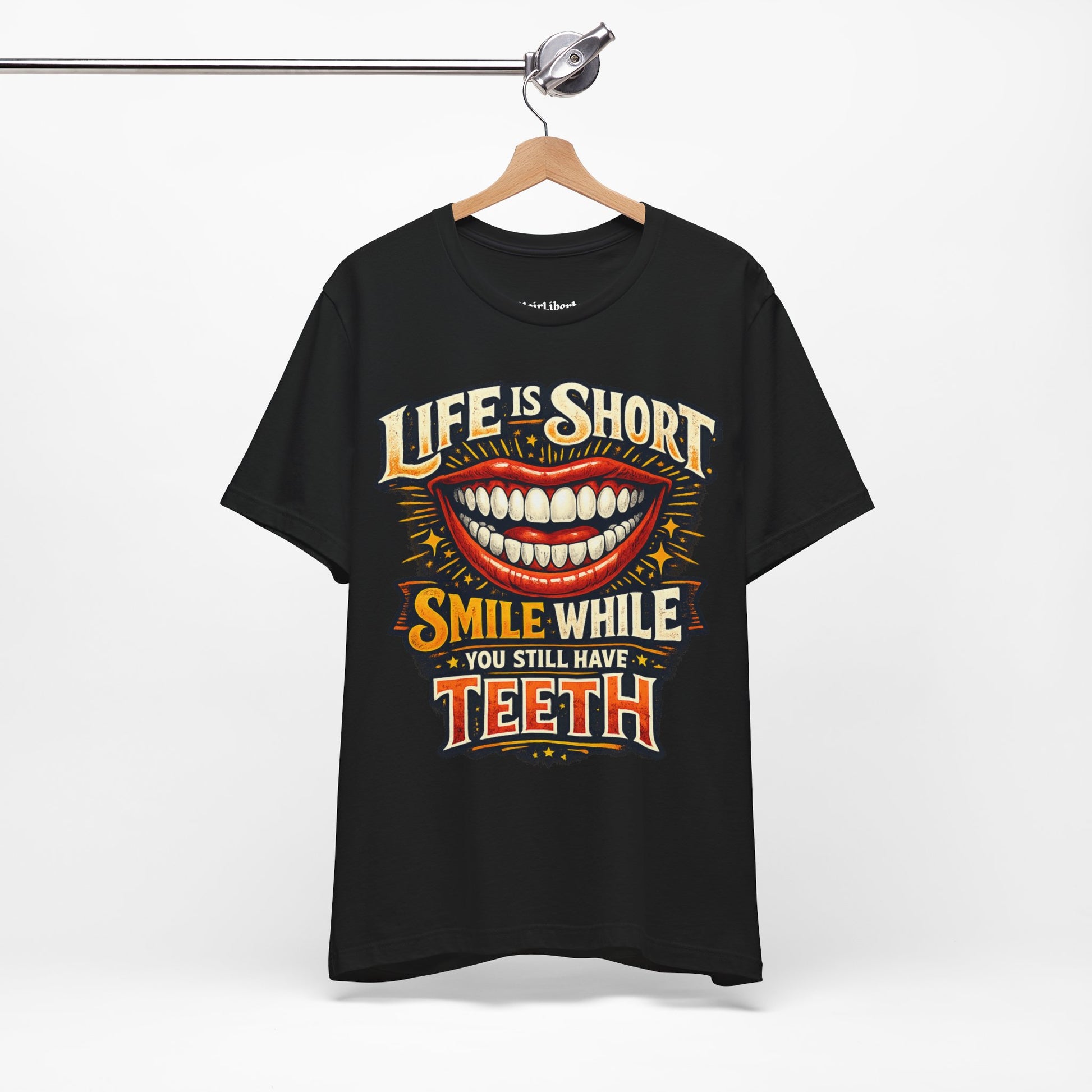 Funny shirt with a funny saying graphic hanging from a cloth hanger